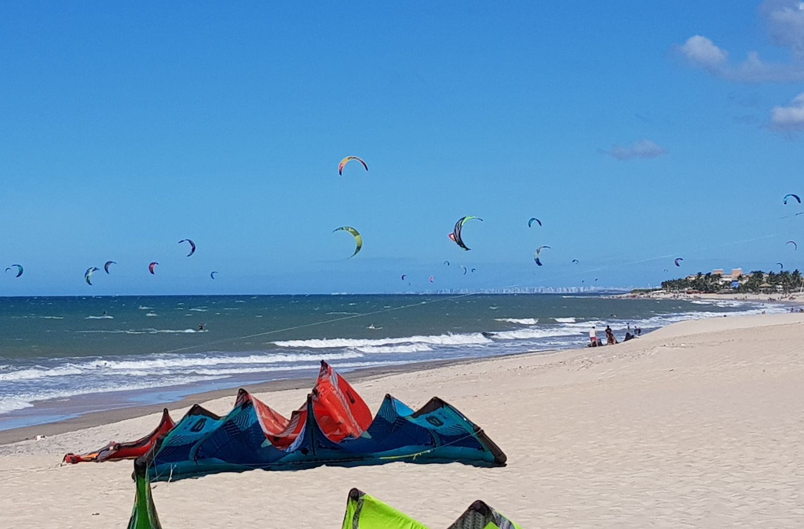 Kites rigged and flying off Praia do Cumbuco in July.